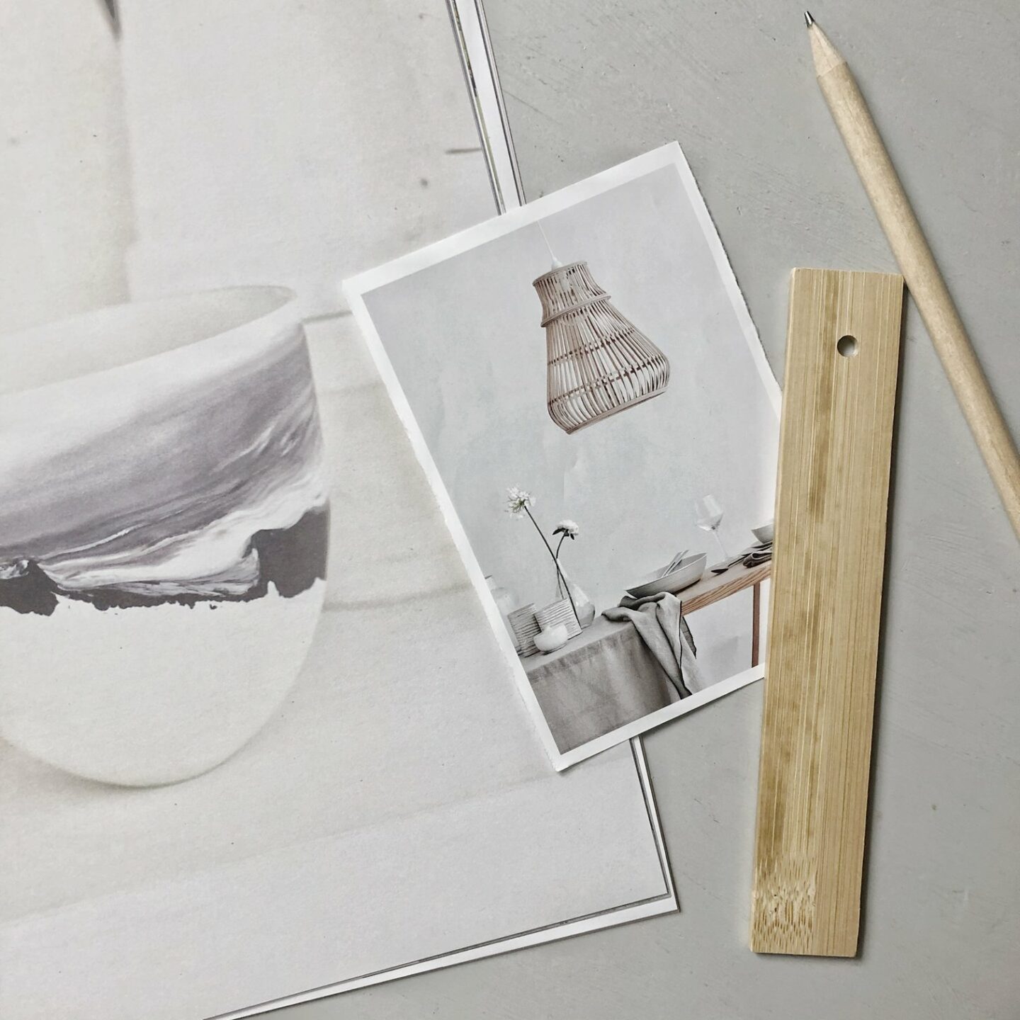 Flatlay on grey background of magazine clippings