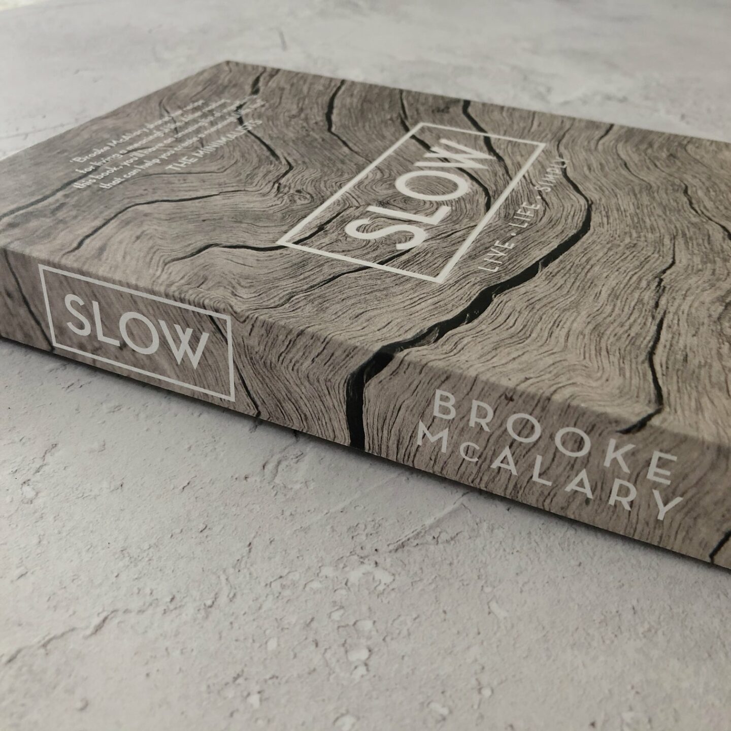 Slow book by Brooke McAlary on grey background