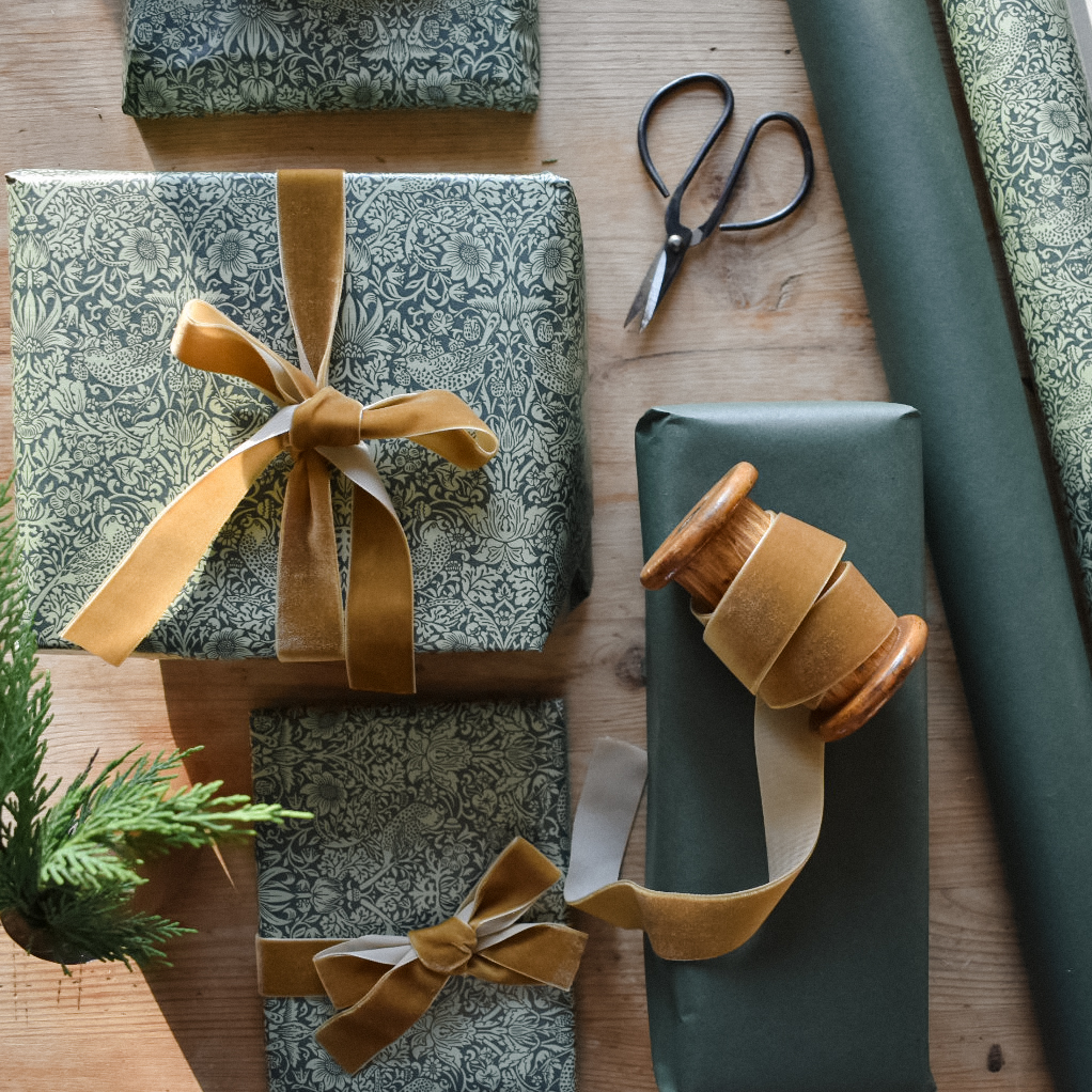 Christmas wrapping flat lay with velvet ribbon
