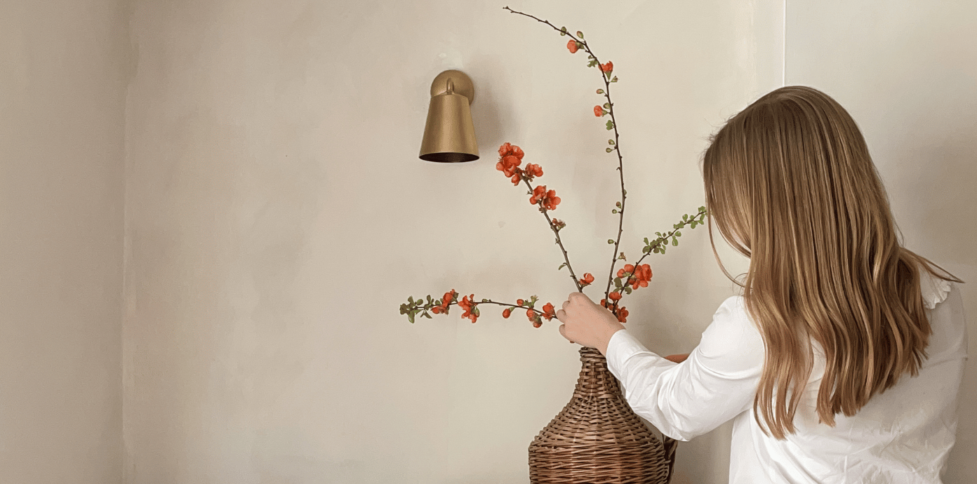 Arranging blossom in vase
