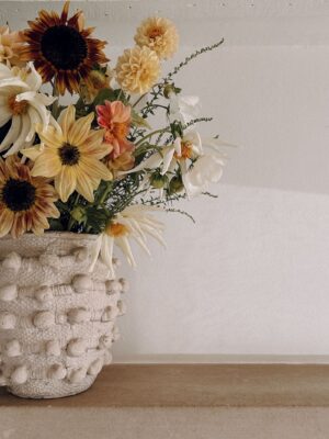 Sunflowers, dahlias and cosmos in a rustic vase